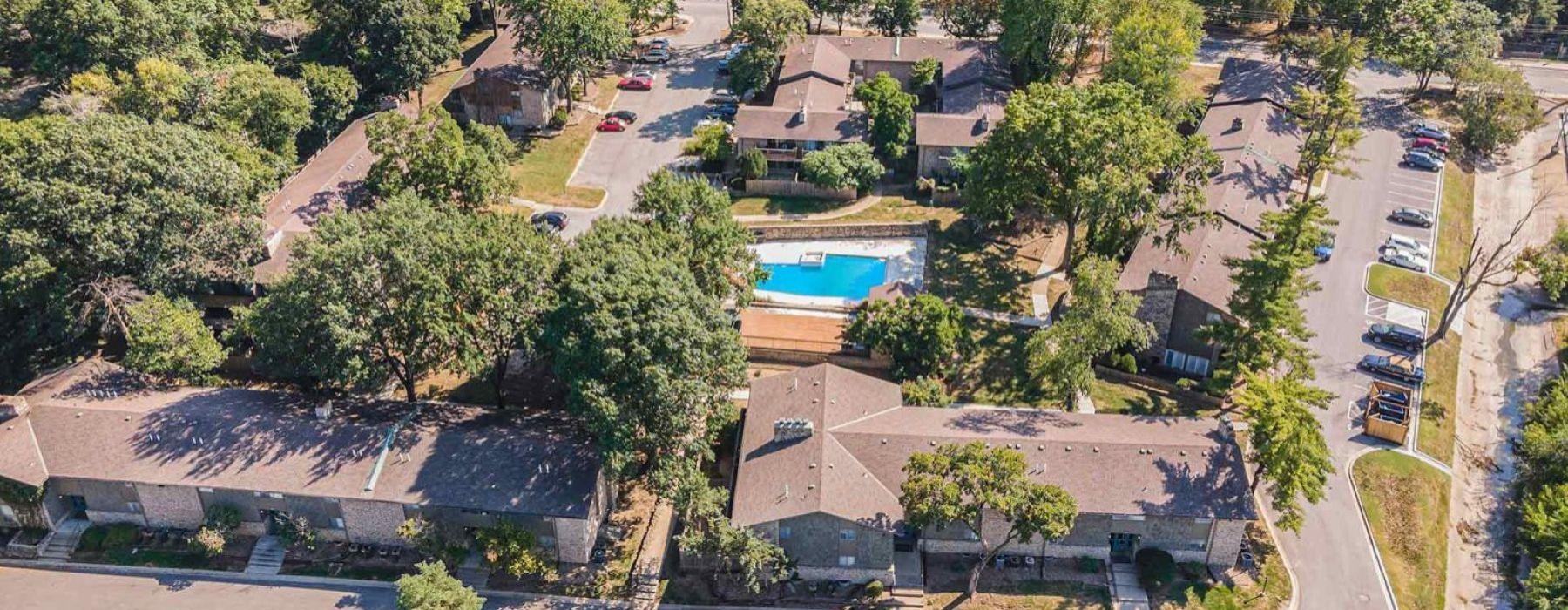 a high angle view of a building complex with trees