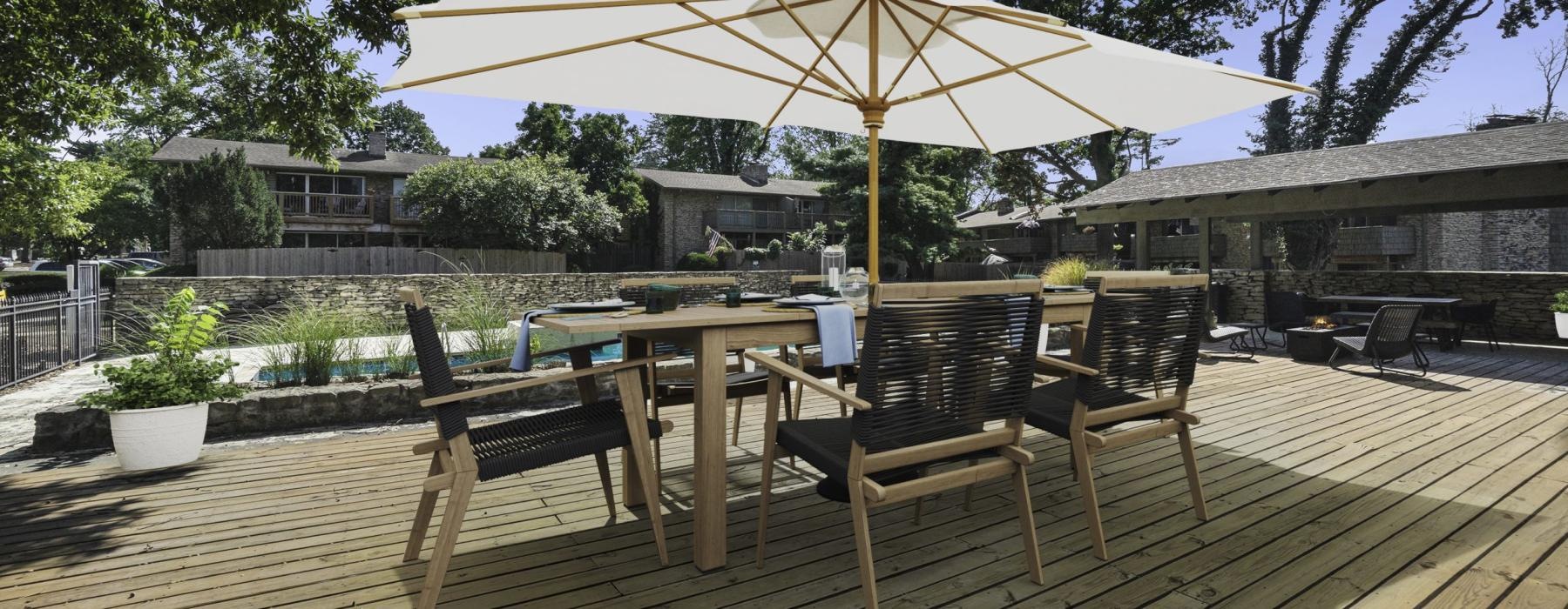 a table and chairs on a deck